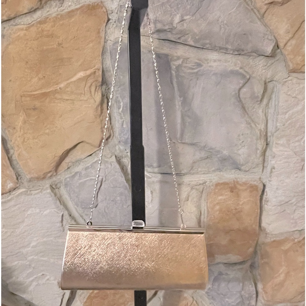 Rose gold metallic clutch. Never worn.